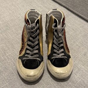 Golden Goose Black, Gold, and Red High-Top Sneakers